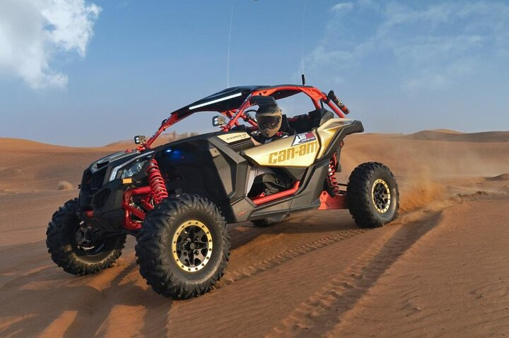 Experience the desert like never before with the Can-am Maverick X3 Turbo as you navigate the stunning red sands and uncover the secrets of Arabian life on an unforgettable quadbike adventure.